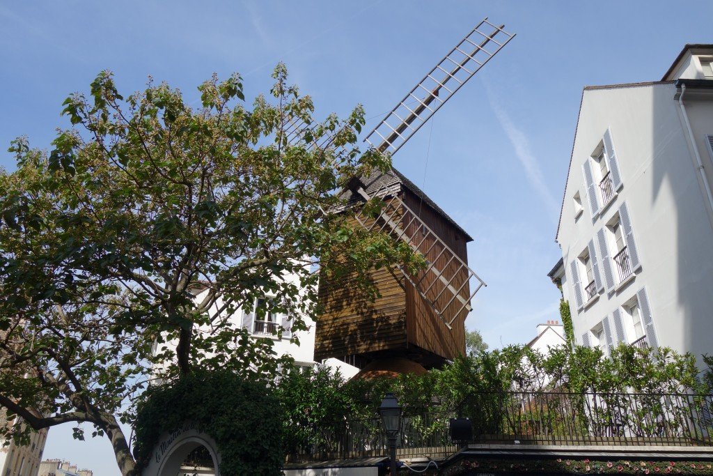 One of the remaining actual windmills, now restored, with a city growing around it instead of fields of wheat.