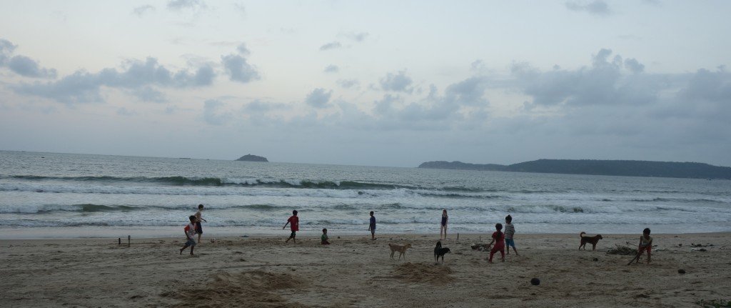 Caleb and Anna playing with kids on the beach. Great fun, but still sad because the locals should be in school.