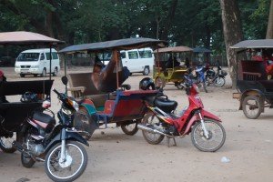 After sunrise we went to find our tuk tuk driver to explore the other temples while the crowd was still at Angkor. There were hundreds of tuk tuk's like this lined up under trees with the driver's napping in their hammocks.